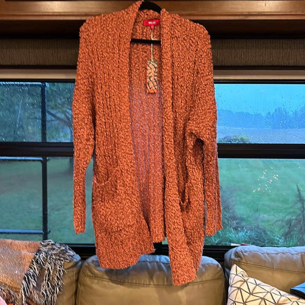 NWT women’s long sleeve cardigan with pockets. Size s/m but fits like a large
